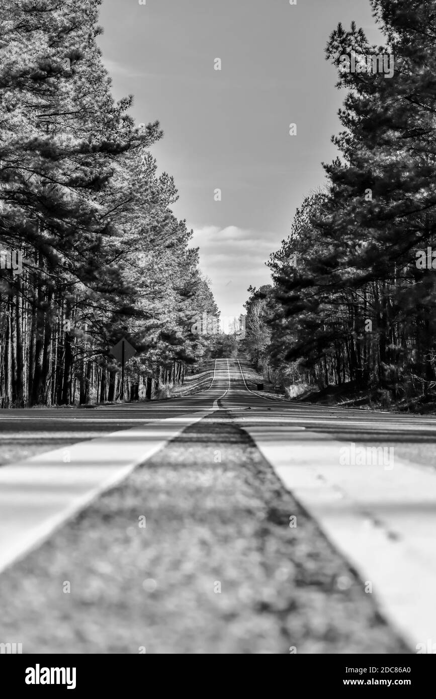 Low angle view of empty highway road in the country under blue sky and clouds Stock Photo