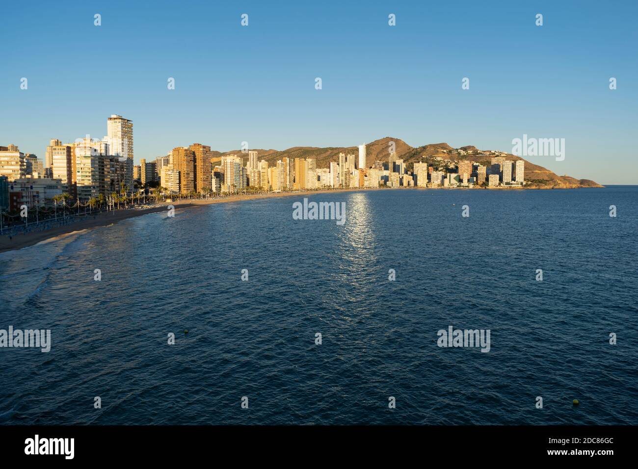 Benidorm , beach panorama and skyline at sunset.Famous vacations destination in Costa Blanca, Spain.Summer holidays background concept. Stock Photo