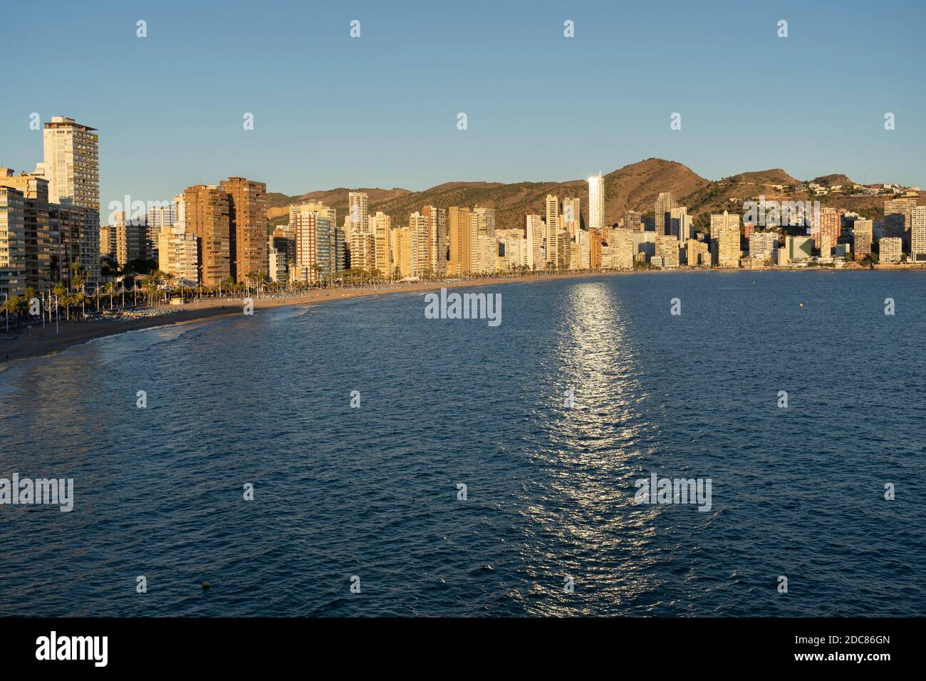 Benidorm , beach panorama and skyline at sunset.Famous vacations destination in Costa Blanca, Spain.Summer and holidays background.Travel concept. Stock Photo