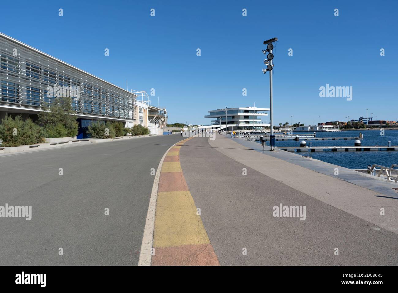 Valencia,Spain-October 11 ,2020:View of America's Cup Building,( VELES E VENTS)and people walking on the old road circuit of Formula 1 Grand Prix of E Stock Photo