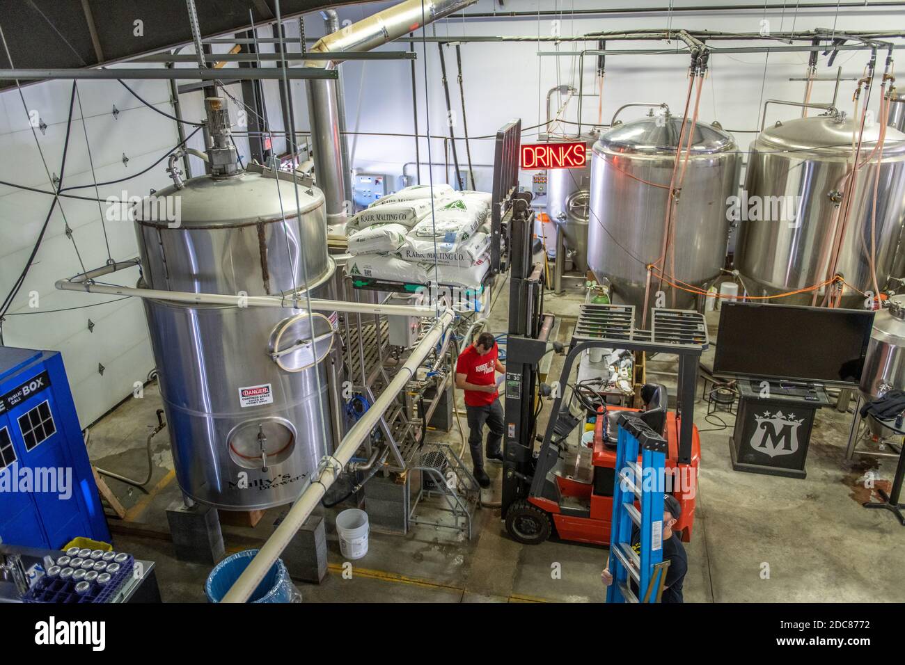 Forklift and worker at a beer making factory at MullyÕs Brewery in