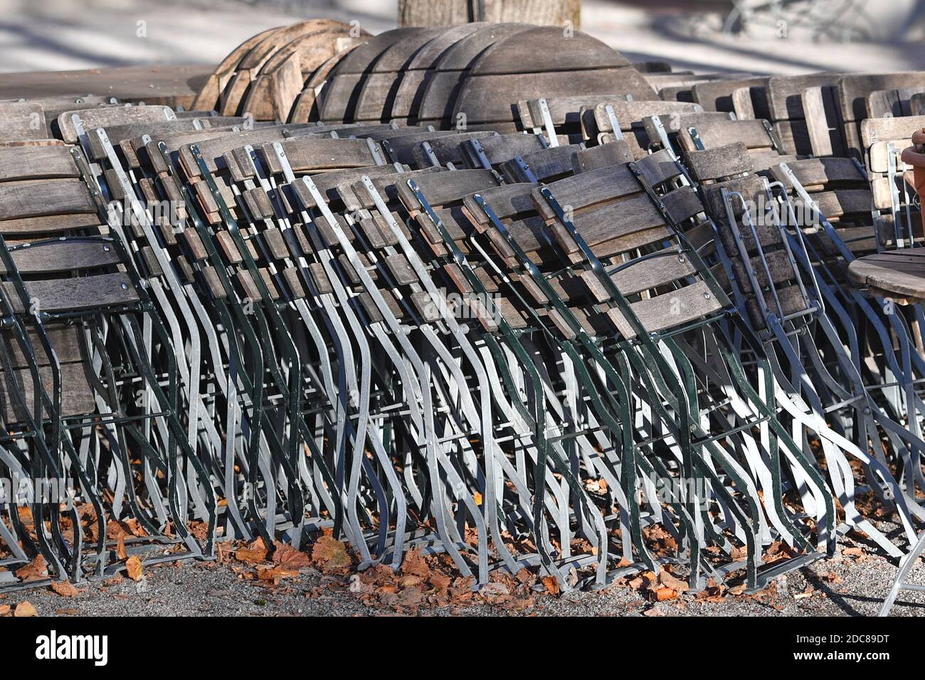 Munich, Deutschland. 18th Nov, 2020. Topic picture: Second wave of the coronavirus pandemic/consequences for the catering trade Stacked chairs and tables in a beer garden in the Hofgarten in Munich on November 18, 2020. | usage worldwide Credit: dpa/Alamy Live News Stock Photo