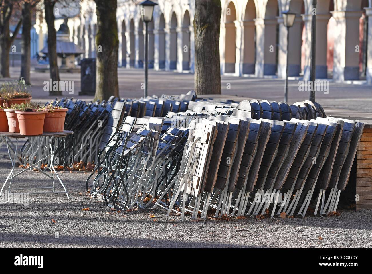 Munich, Deutschland. 18th Nov, 2020. Topic picture: Second wave of the coronavirus pandemic/consequences for the catering trade Stacked chairs and tables in a beer garden in the Hofgarten in Munich on November 18, 2020. | usage worldwide Credit: dpa/Alamy Live News Stock Photo