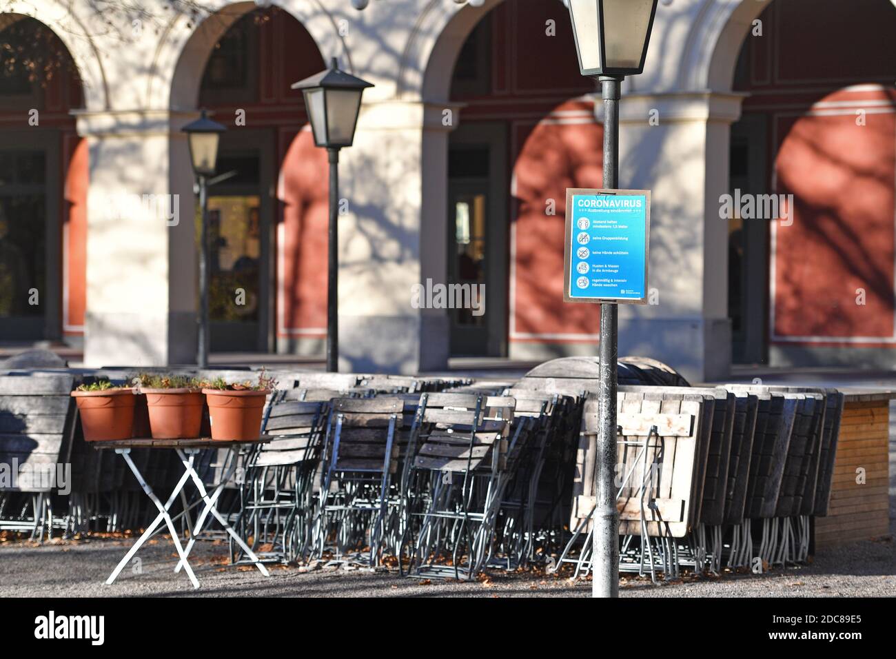 Munich, Deutschland. 18th Nov, 2020. Topic picture: Second wave of the coronavirus pandemic/consequences for the catering trade Stacked chairs and tables in a beer garden in the Hofgarten in Munich on November 18, 2020. | usage worldwide Credit: dpa/Alamy Live News Stock Photo