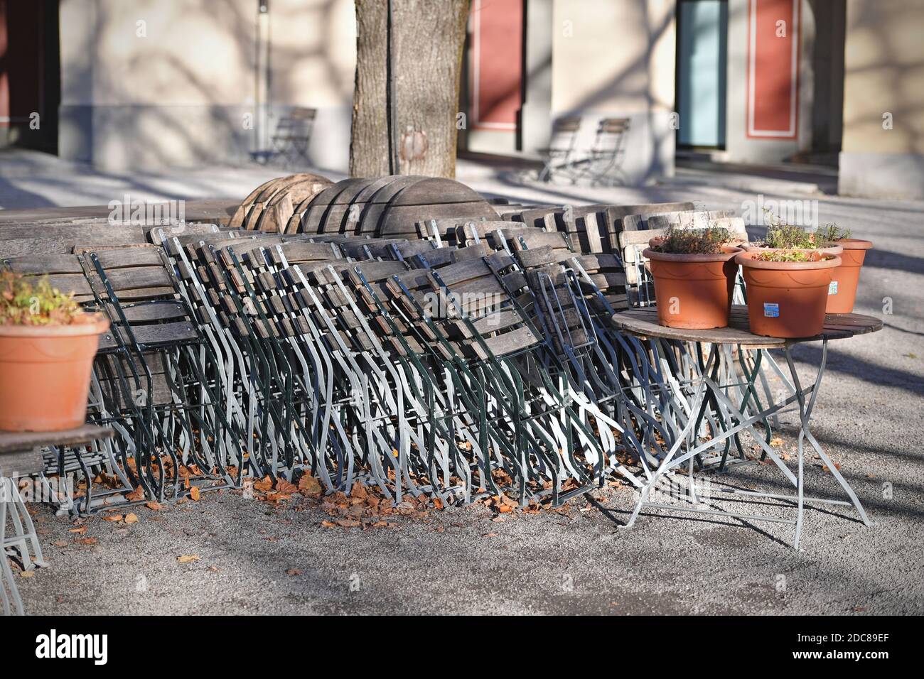 Munich, Deutschland. 18th Nov, 2020. Topic picture: Second wave of the coronavirus pandemic/consequences for the catering trade Stacked chairs and tables in a beer garden in the Hofgarten in Munich on November 18, 2020. | usage worldwide Credit: dpa/Alamy Live News Stock Photo