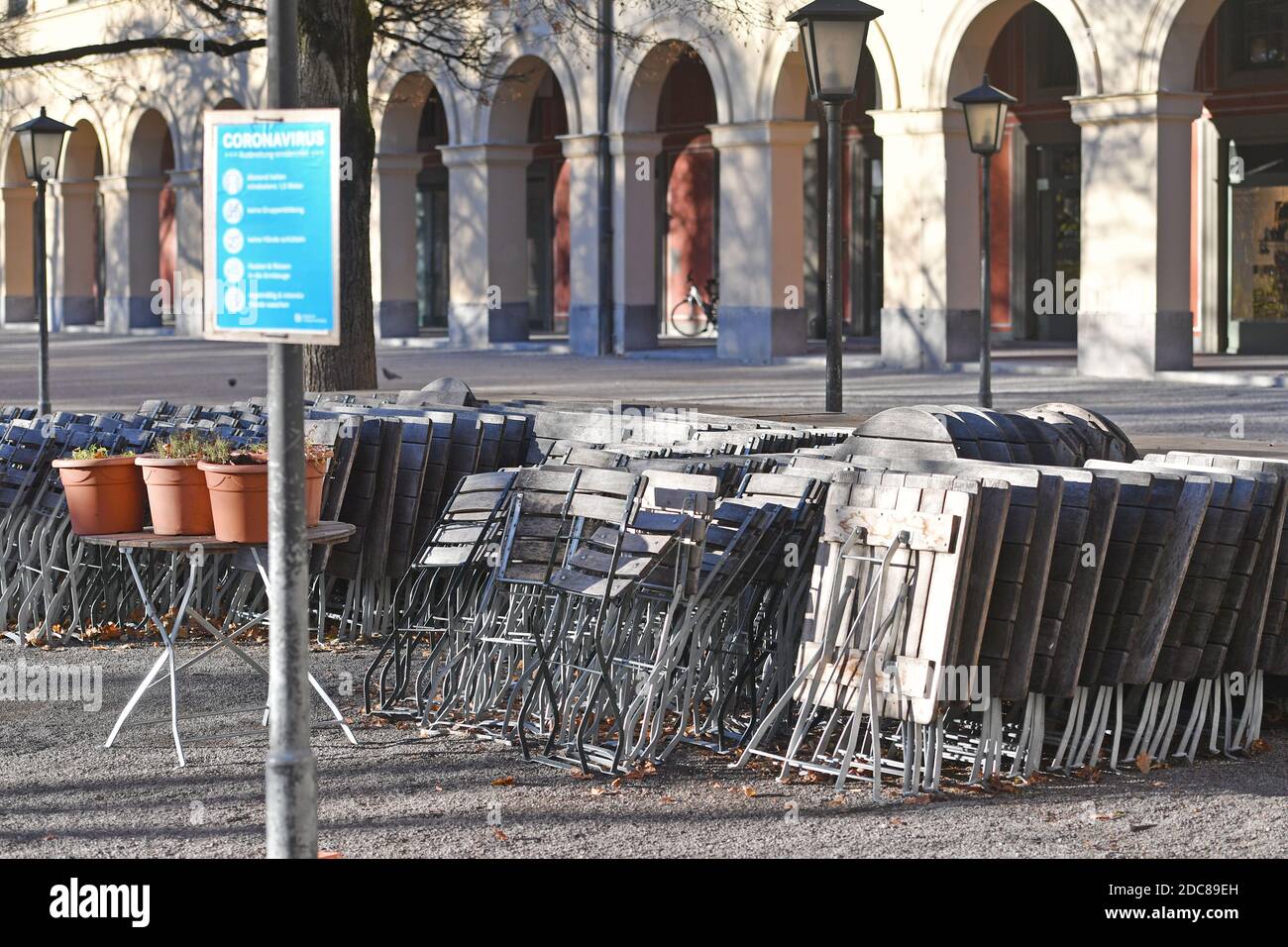 Munich, Deutschland. 18th Nov, 2020. Topic picture: Second wave of the coronavirus pandemic/consequences for the catering trade Stacked chairs and tables in a beer garden in the Hofgarten in Munich on November 18, 2020. | usage worldwide Credit: dpa/Alamy Live News Stock Photo