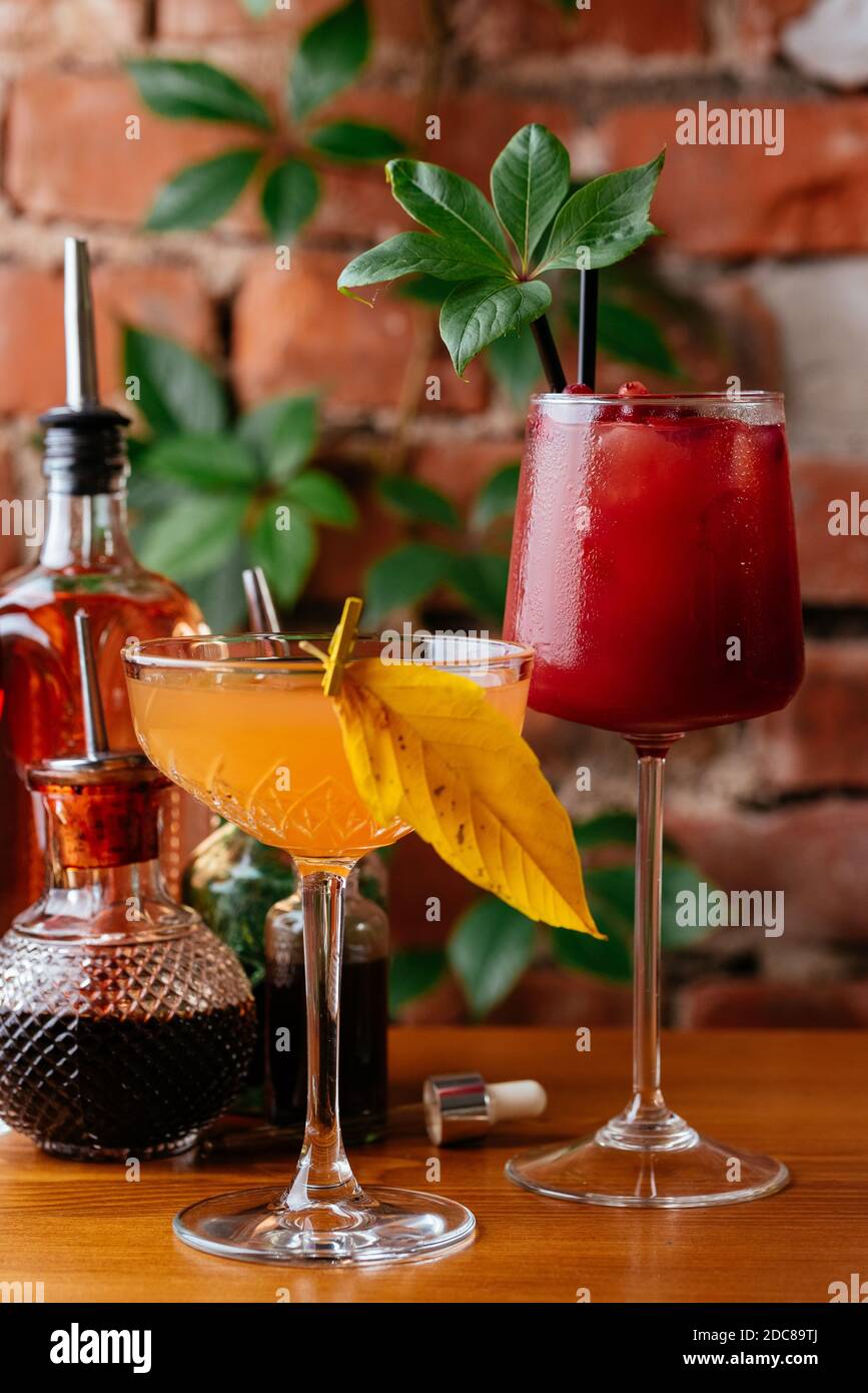 autumn cocktails on a brick wall background Stock Photo Alamy