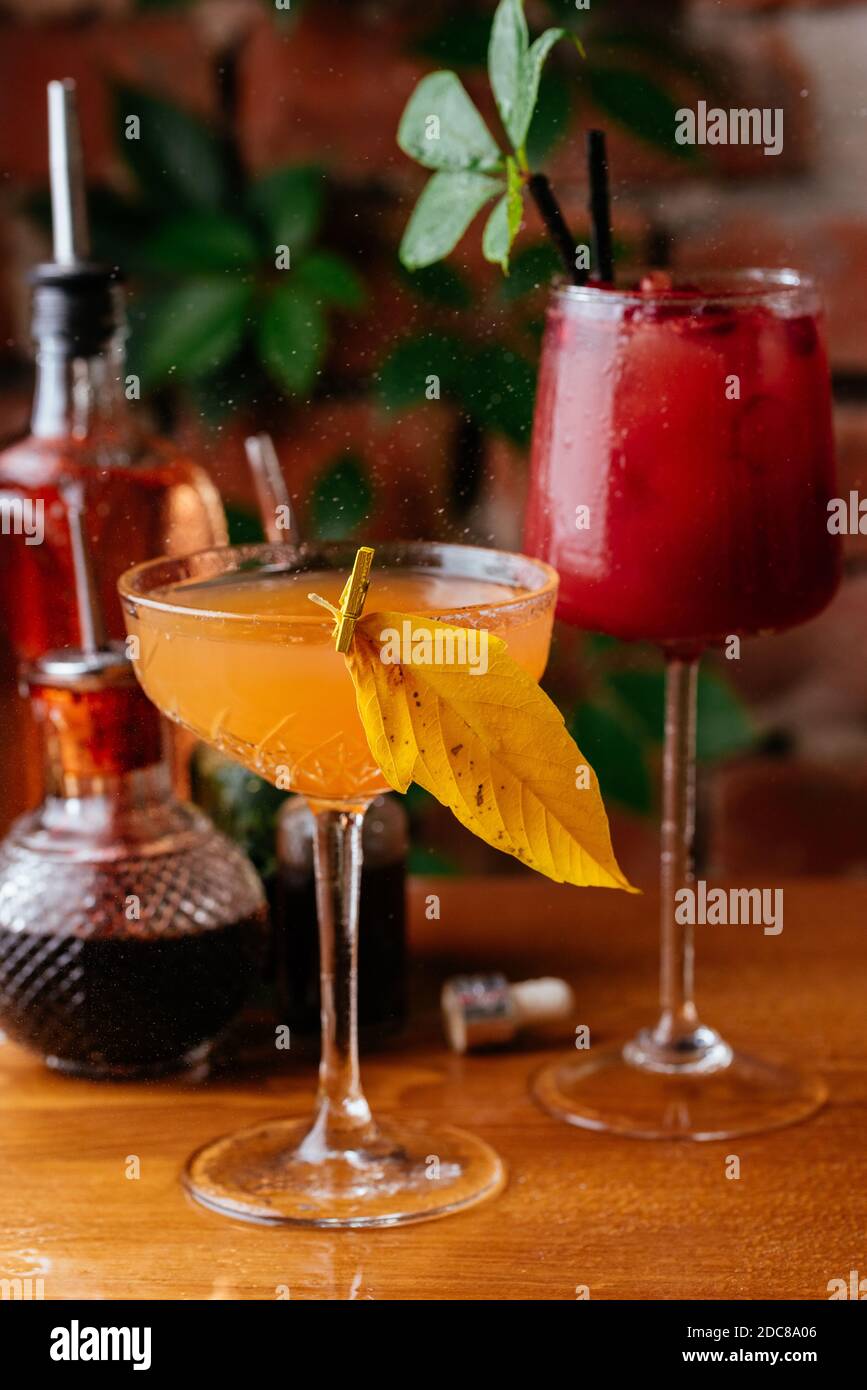 autumn cocktails on a brick wall background Stock Photo Alamy