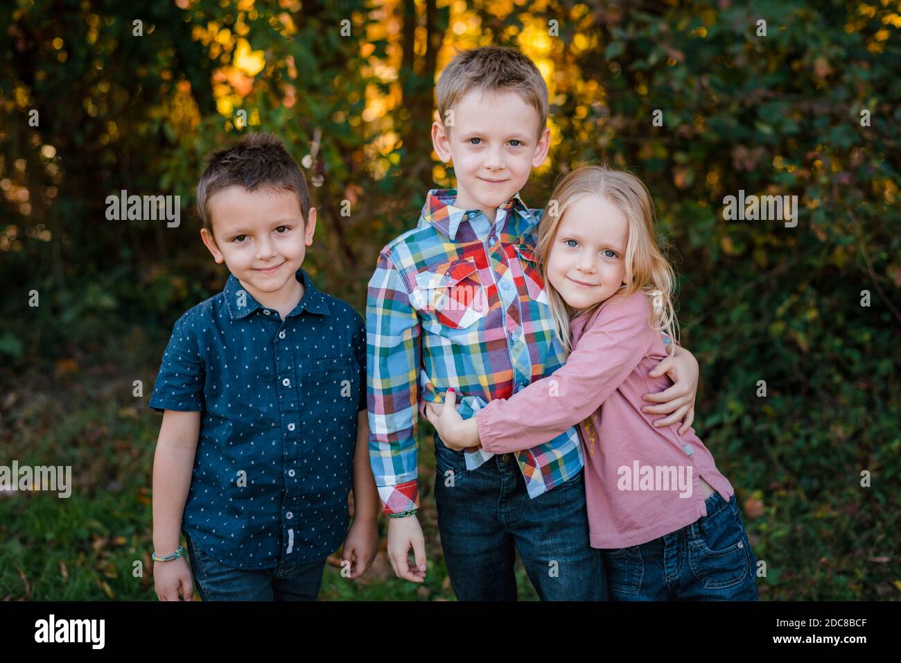 Family brothers and sister portrait outdoors in nature Stock Photo - Alamy