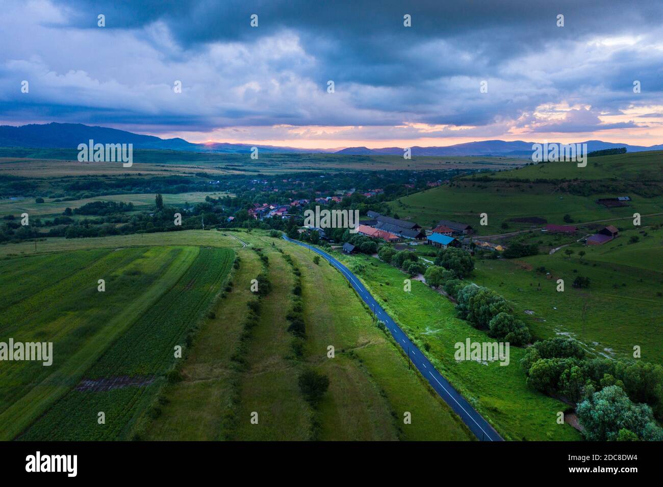 Aerial view of a storm and clouds above a village road Stock Photo - Alamy