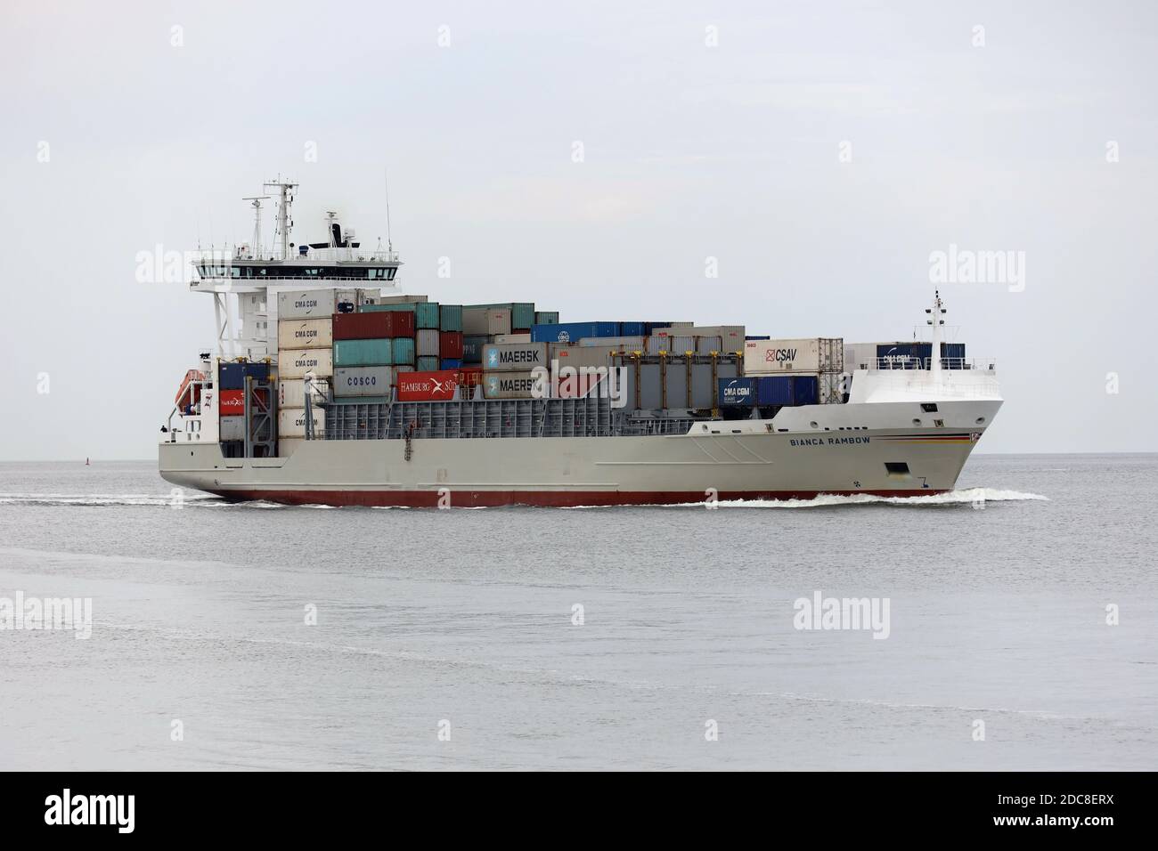 The container ship Bianca Rambow will pass the city of Cuxhaven on the river Elbe on August 20, 2020 on its way to the Kiel Canal. Stock Photo