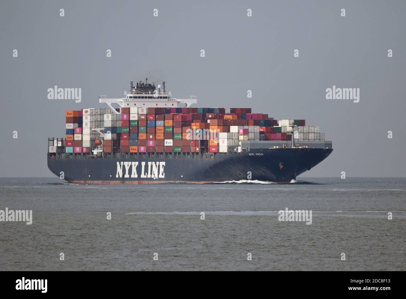 The container ship NYK Vega will pass Cuxhaven on August 20, 2020 on the Elbe river and will continue to Hamburg. Stock Photo