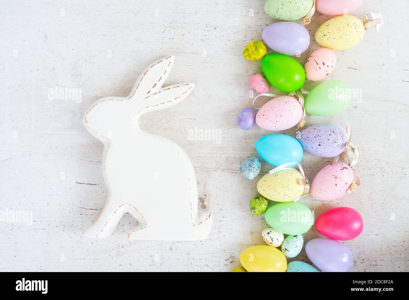 Easter colored eggs with tulips Stock Photo - Alamy