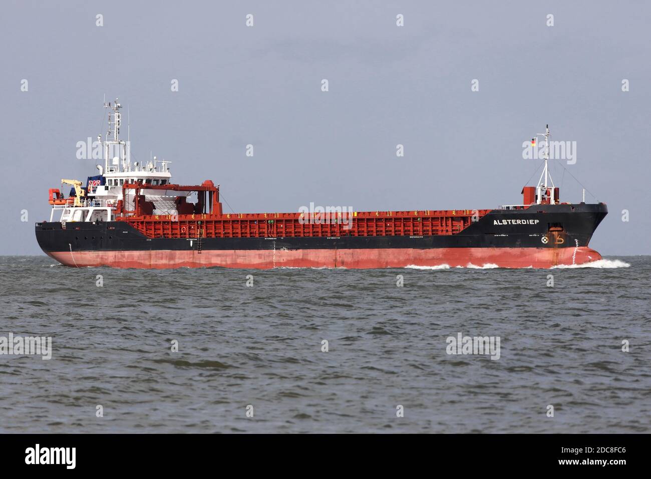The cargo ship Alsterdiep will pass the Kugelbake in Cuxhaven on August 22, 2020 and will continue towards Hamburg. Stock Photo