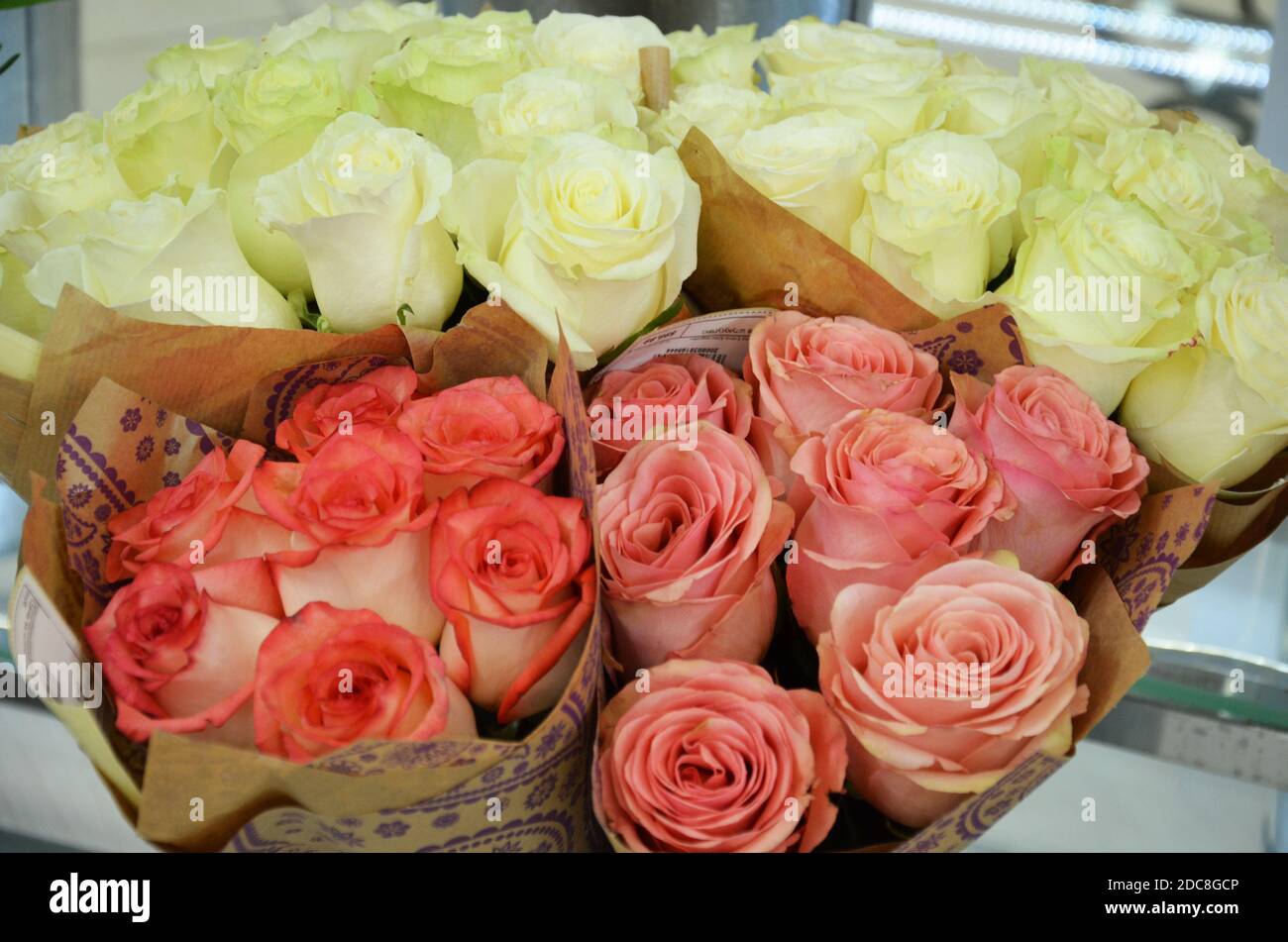 Beautiful bouquets of roses are presented in street flower shop Stock