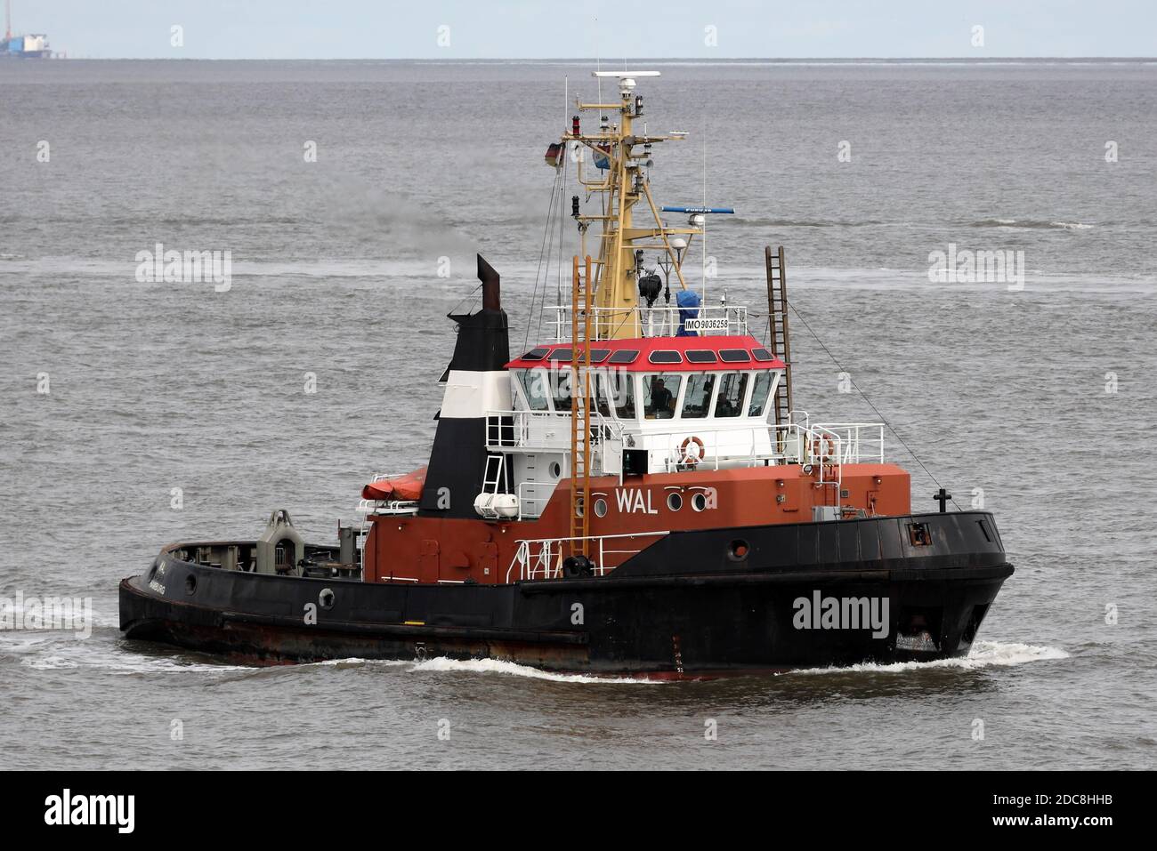 The harbor tug Wal will pass the port of Cuxhaven on August 25, 2020 and continue towards Brunsbüttel. Stock Photo