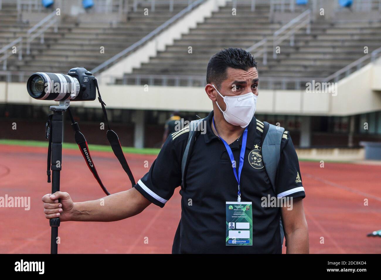 Africa Cup of Nations qualifiers 2020. A photographer during a football match between Zimbabwe and Algeria in Harare.  Zimbabwe played its first official soccer match since lockdown. The balls had to be sanitized each time it went out of play. Zimbabwe. Stock Photo