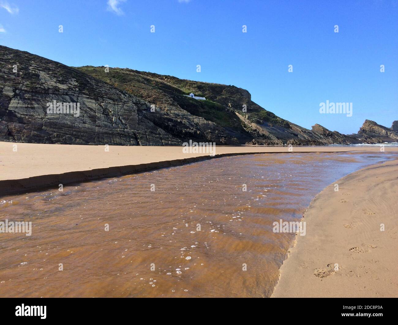 river flows into the ocean, stream flows to the sea, sandy river ...
