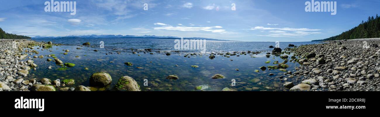 Panoramic view of the discovery islands and the Salish Sea from a rocky beach on Quadra Island Stock Photo