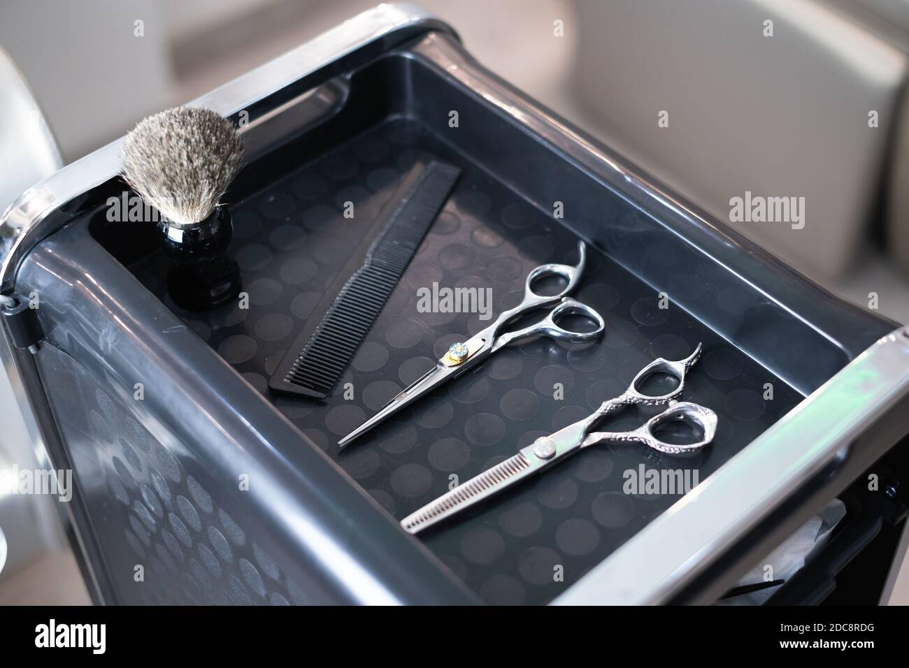 Stylish professional barber scissors and combs, hairdresser salon concept, hairdressing tool set. Haircut accessories Stock Photo