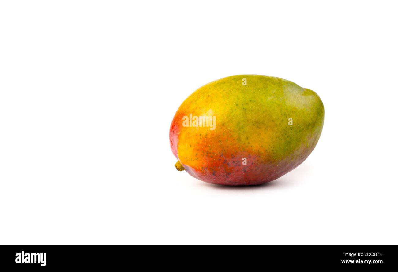 Fruit background with ripe mango on white background. Stock Photo