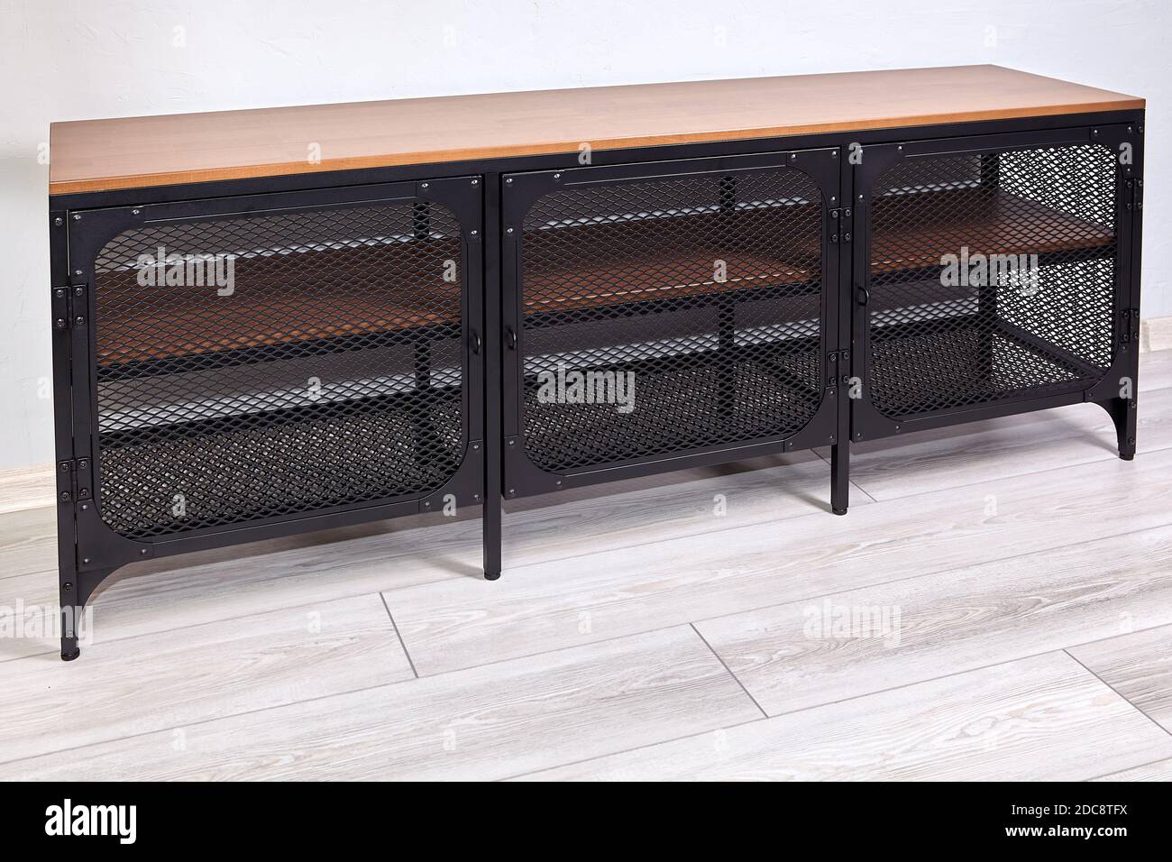 Shoe rack in the hallway of house is made of wood and metal Stock Photo ...