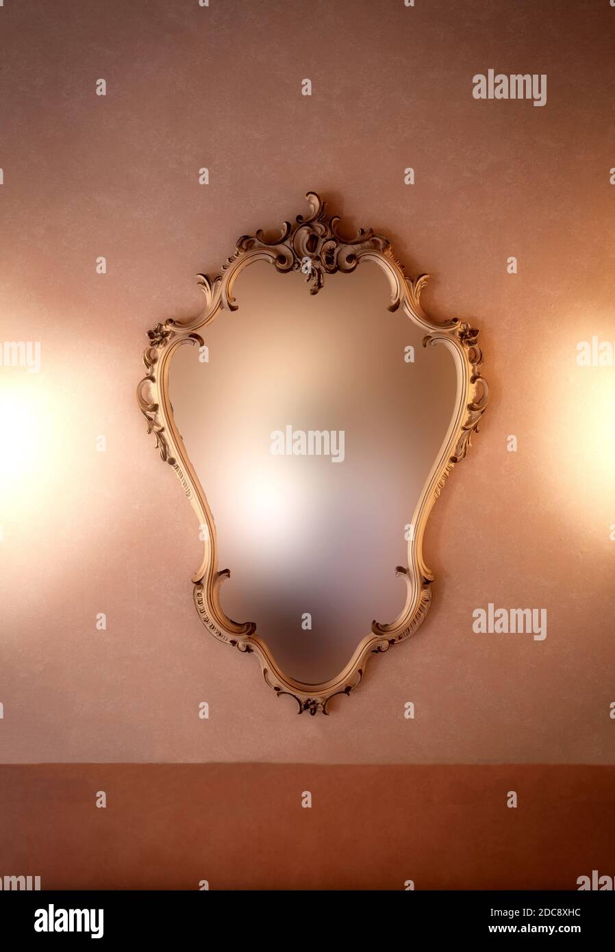Old fashioned luxury gold colored frame mirror antique design, hanging
