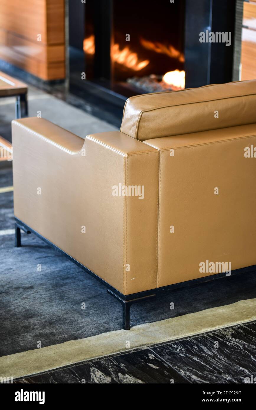 empty lounge chair by the fireplace Stock Photo Alamy