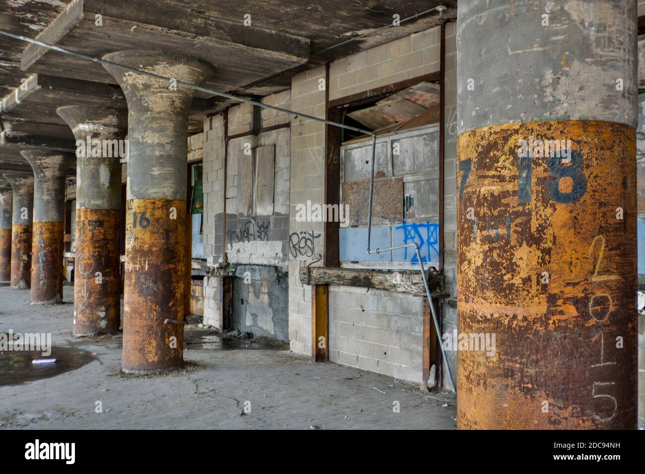 Old and abandoned warehouse loading docks that are falling apart and desolate Stock Photo
