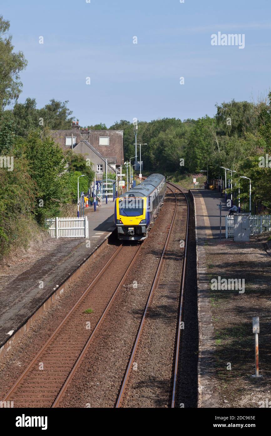 Northern Rail CAF class 195 train 195130 calling at the small country railway station at