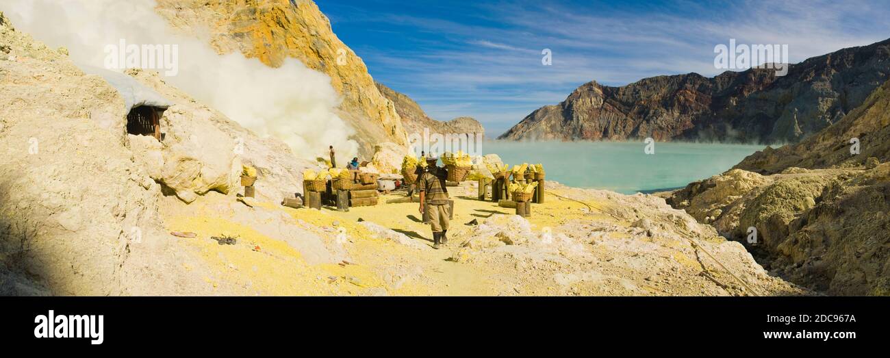 Sulphur miner working at the bottom of Kawah Ijen crater, East Java ...