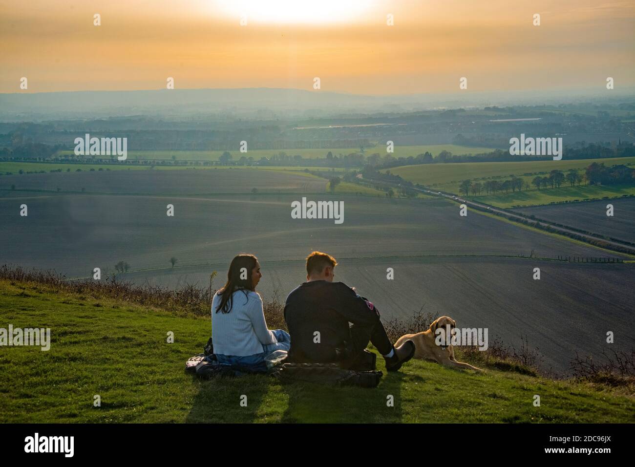 Seated couple and dog Ivanhoe Beacon with view of Buckinghanshire