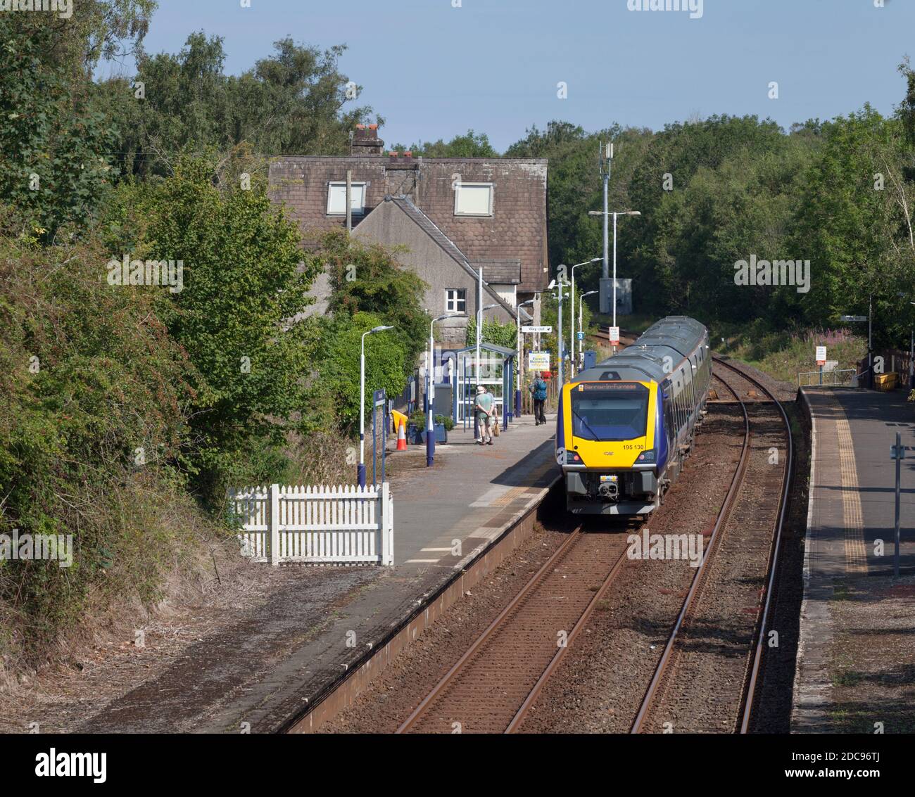 Northern Rail CAF class 195 train 195130 calling at the small country railway station at
