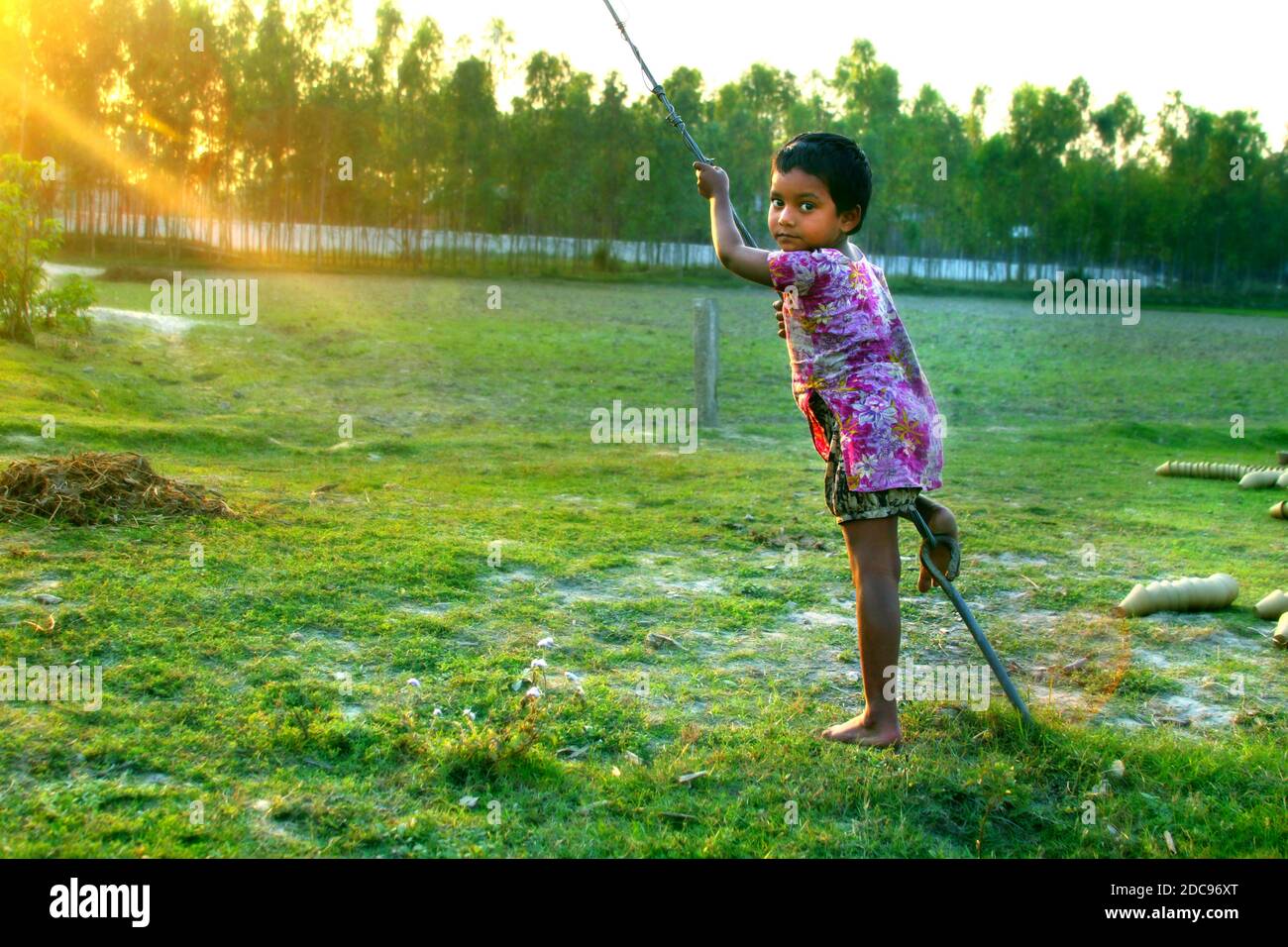 Street child playing in Bangladesh Stock Photo