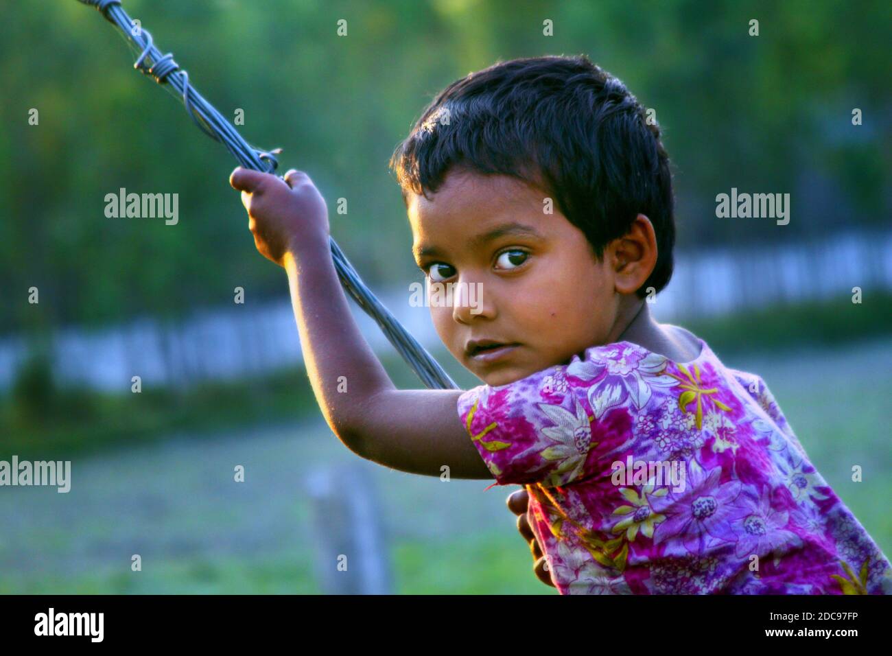 Street child playing in Bangladesh Stock Photo
