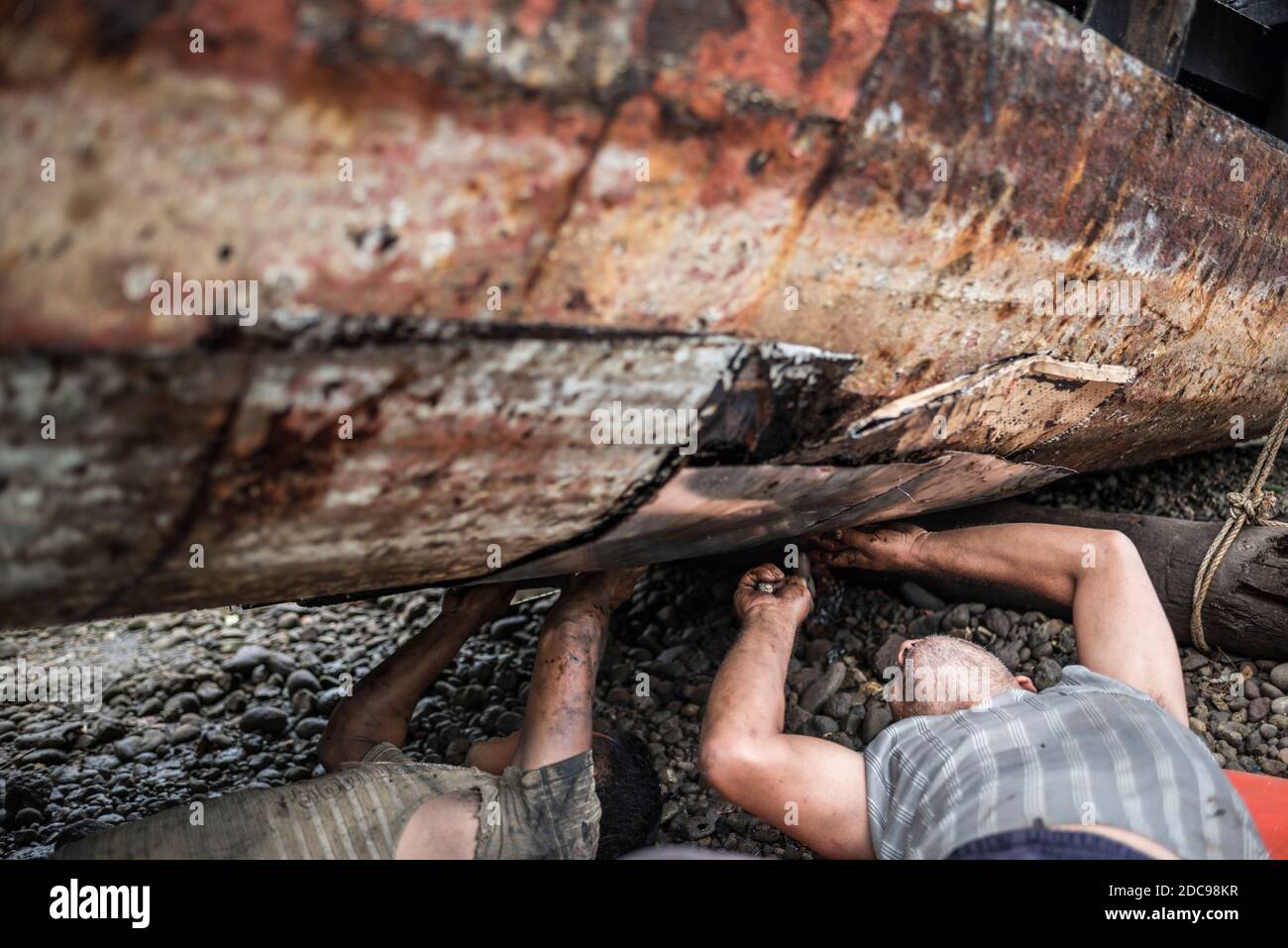 Repairing old fishing boats near Iboih, Pulau Weh Island, Aceh Province, Sumatra, Indonesia, Asia Stock Photo