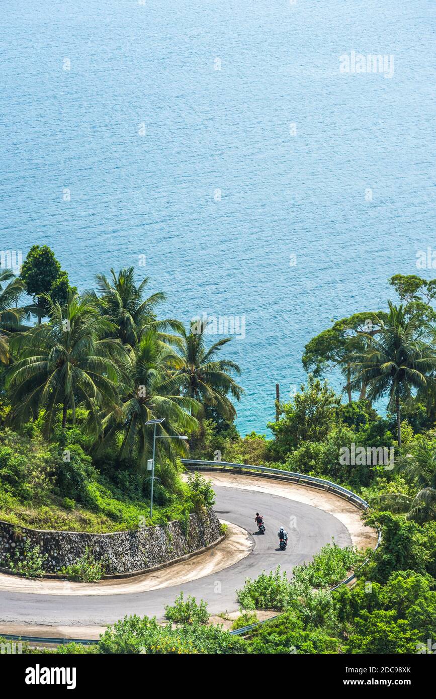 Tourists exploring Pulau Weh Island by Motorcycle, Aceh Province, Sumatra, Indonesia, Asia, background with copy space Stock Photo