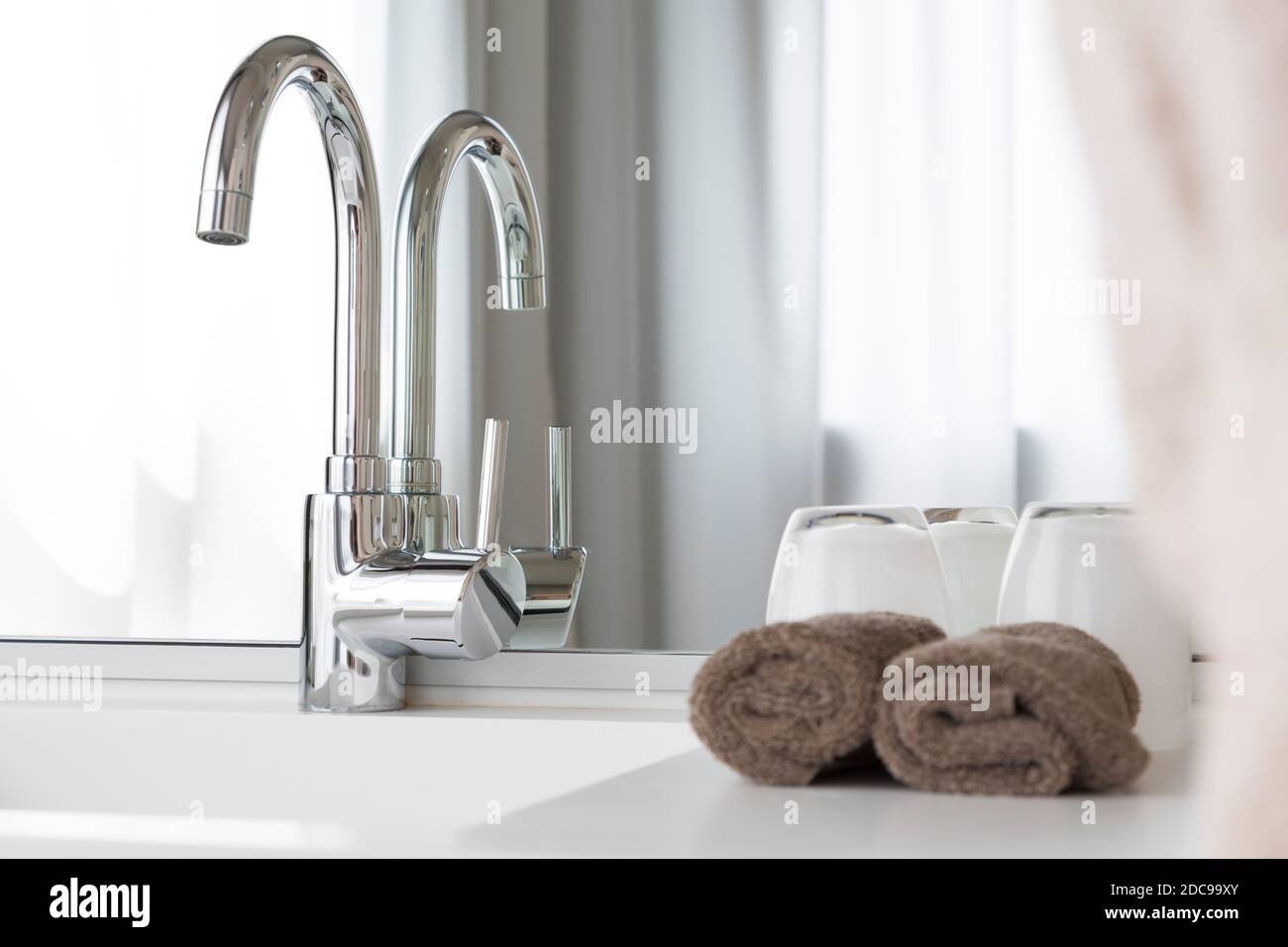 Bathroom interior design, counter top, wash basin or sink and  mixer tap, UK Stock Photo