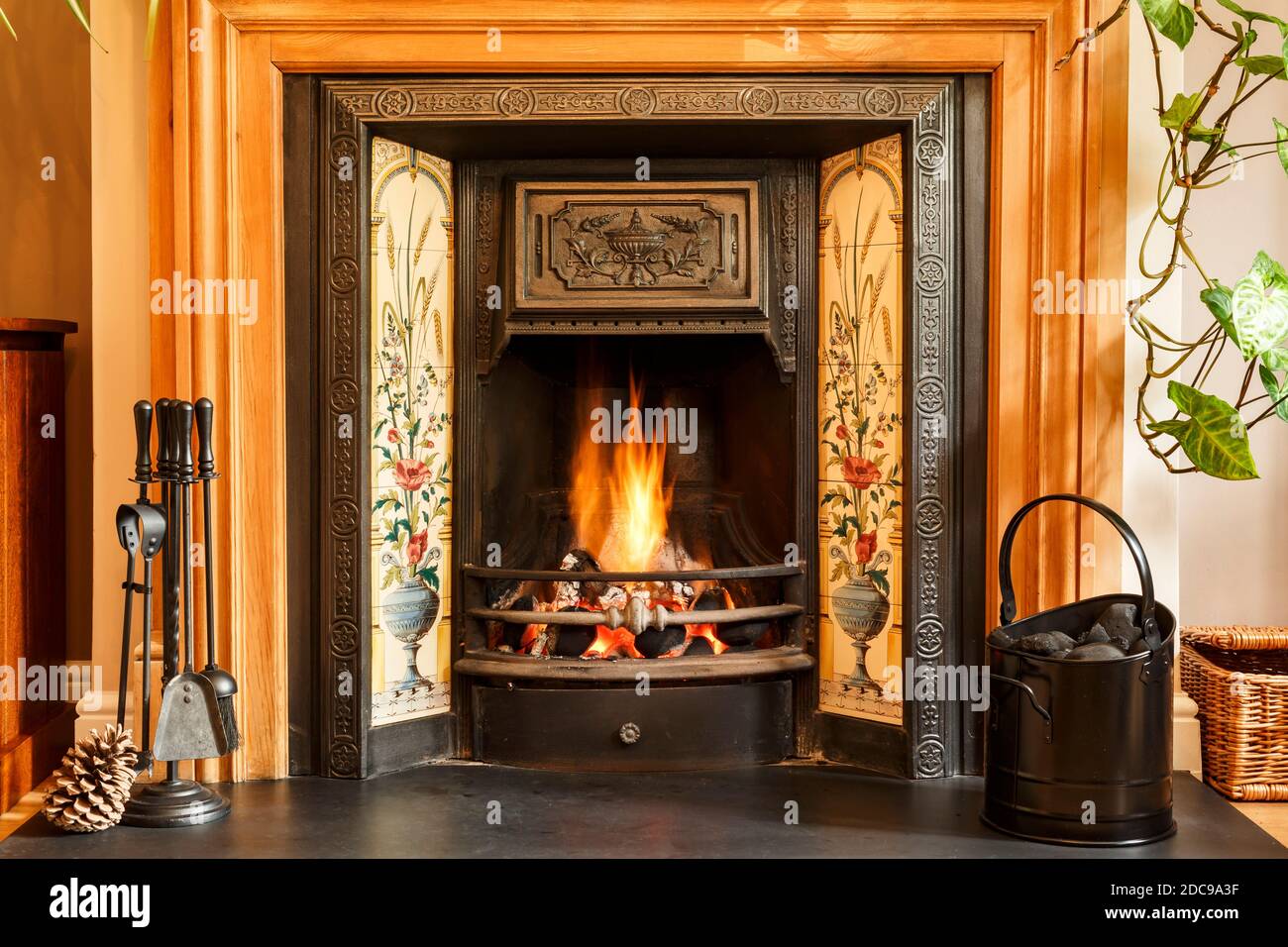 Close up fireplace, traditional Victorian style open fire place burning coal in a UK living room Stock Photo