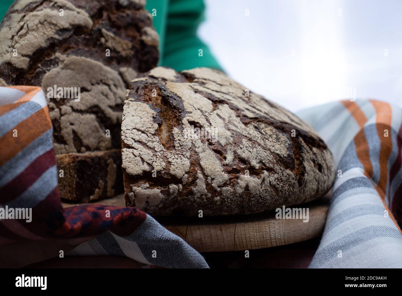 Homemade bread that is prepared in a roll and is pressed with white