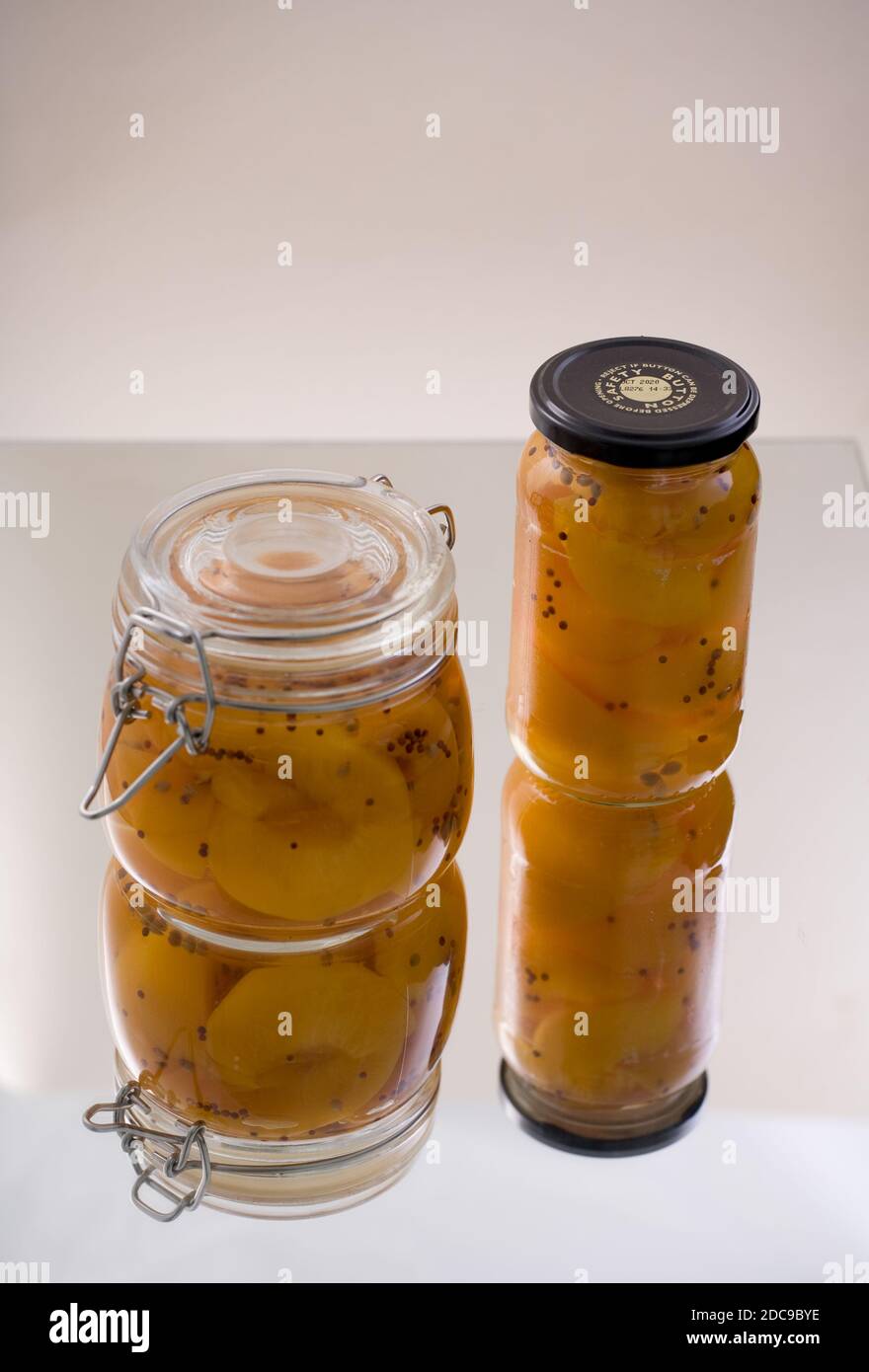 Pickled fruit in glass jars Stock Photo Alamy