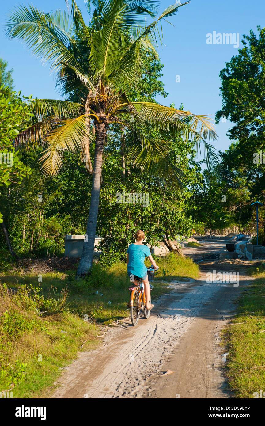 Tourist Cycling Around Gili Trawangan, Gili Isles, Indonesia, Asia Stock Photo