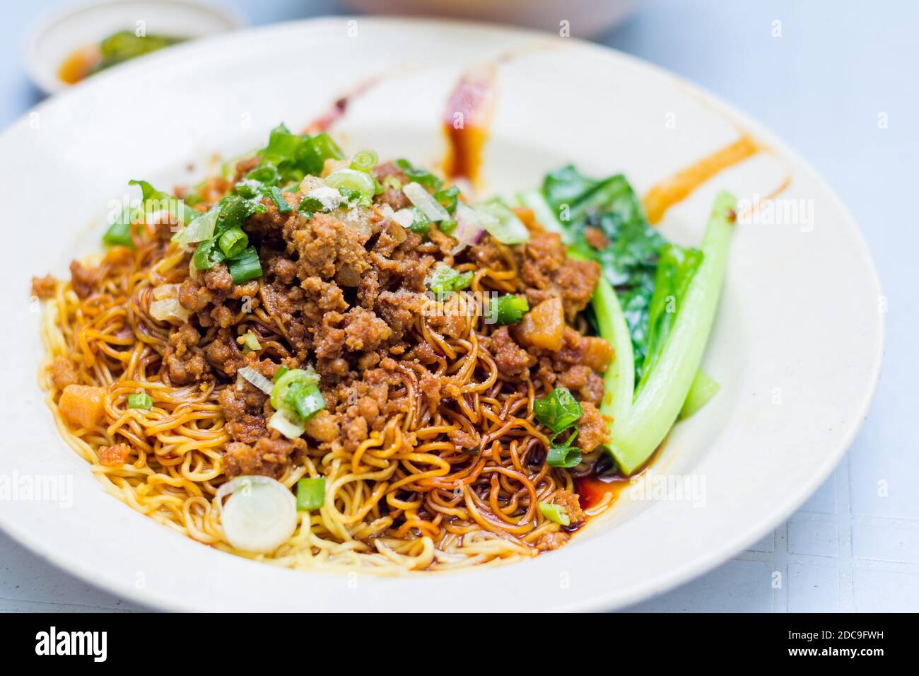 A bowl of noodles at a local restaurant in Kuala Lumpur, Malaysia Stock Photo