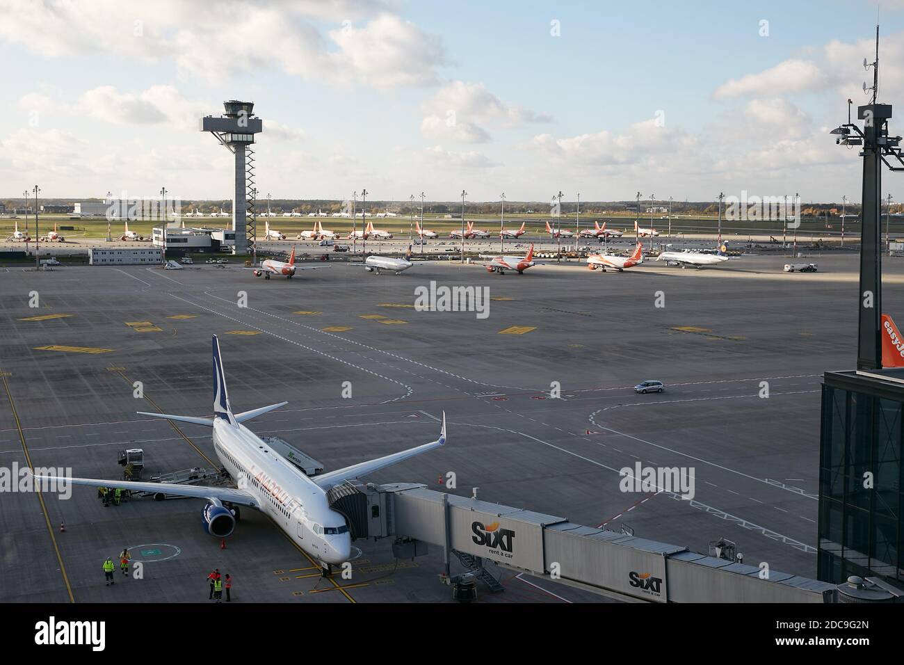 05.11.2020, Schoenefeld, Brandenburg, Germany - View of the apron from the visitor's terrace of Berlin Brandenburg BER Airport. There are parked airpl Stock Photo