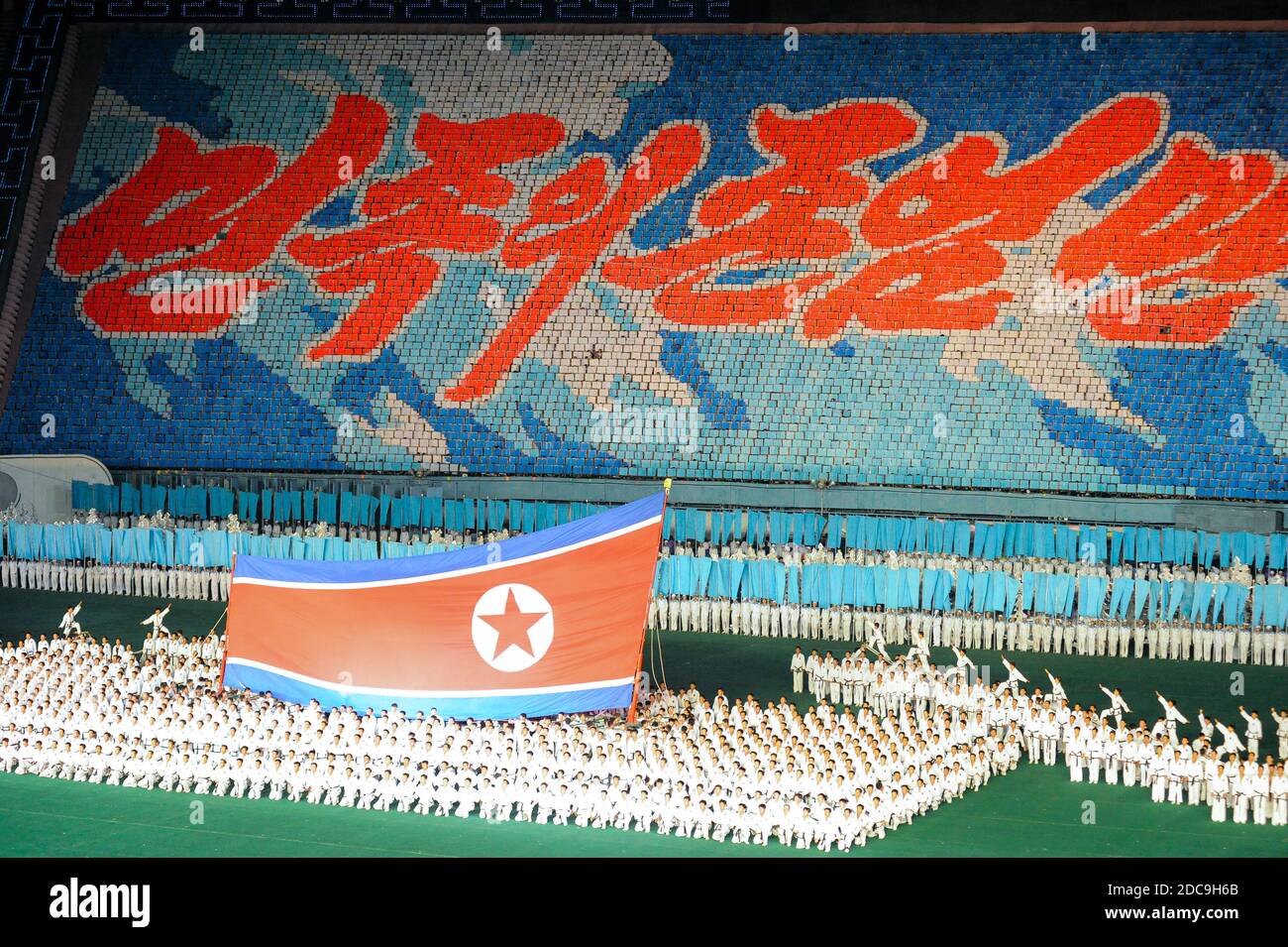 08.08.2012, Pyongyang, , North Korea - Several thousand people will form huge mosaic pictures with colorful posters on the stands at the May Day Stadi Stock Photo