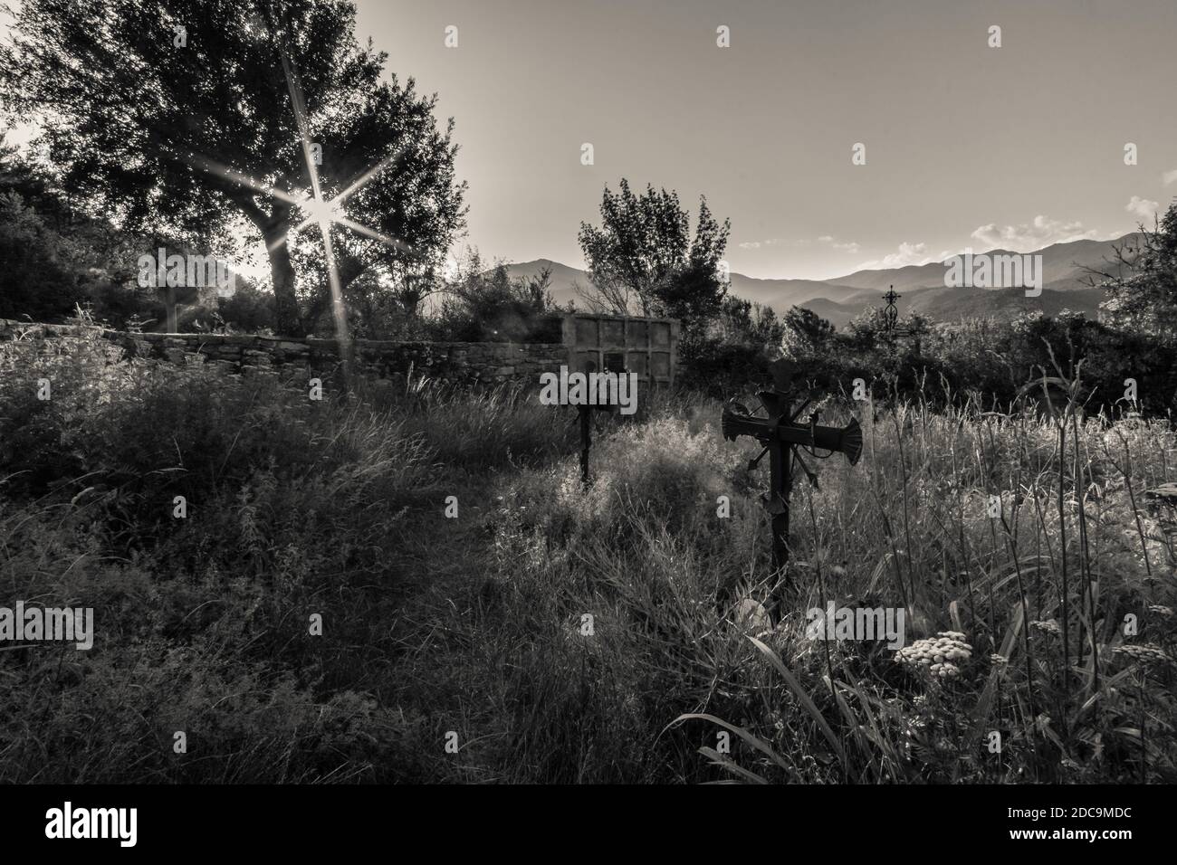 black and white image of a abandoned grave yard in spain Stock Photo