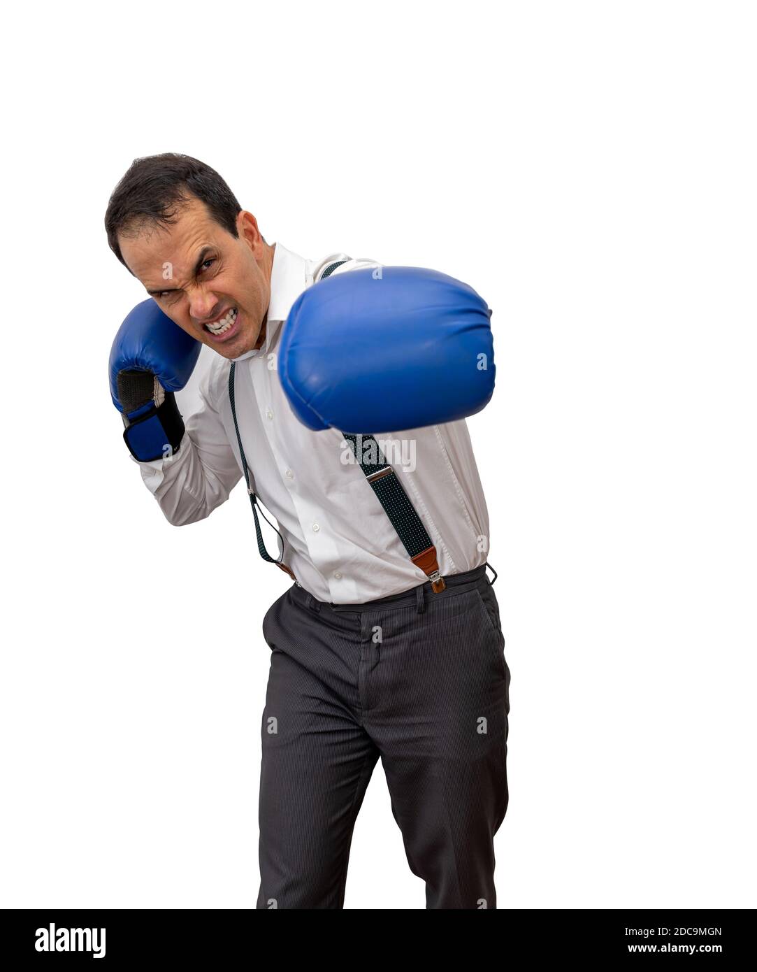 Mature man with formal clothes, suspenders and boxing gloves, striking with the left (white background). Stock Photo
