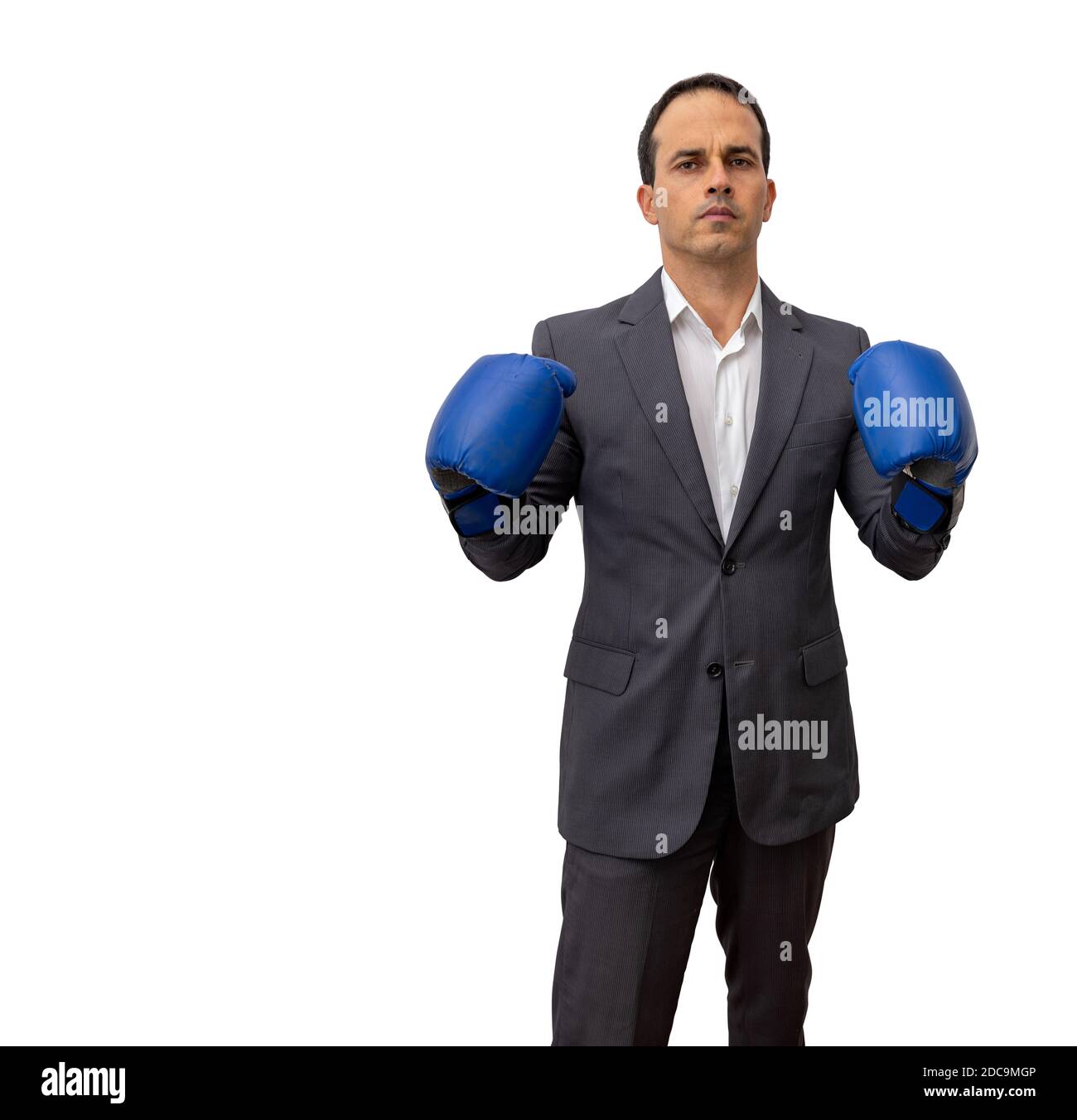 Man standing in formal clothes and boxing glove doing fight positions (white background). Stock Photo