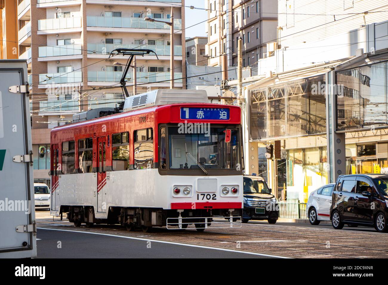 Nagasaki, Japan - 4 November 2020: Red and white streetcar in Nagasaki Stock Photo