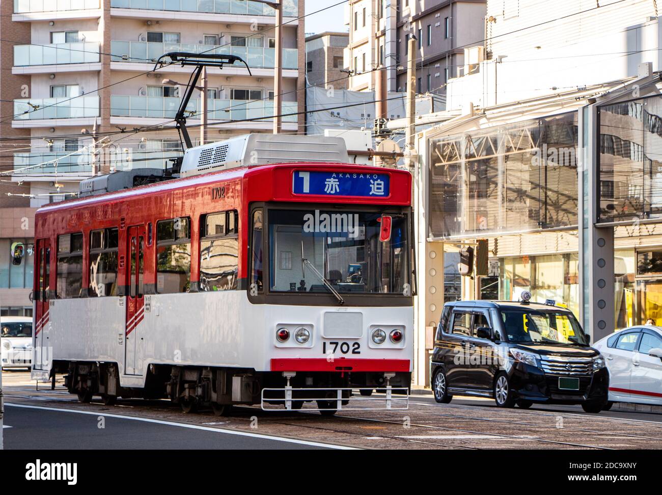 Nagasaki, Japan - 4 November 2020: Red and white tram in Nagasaki Stock Photo